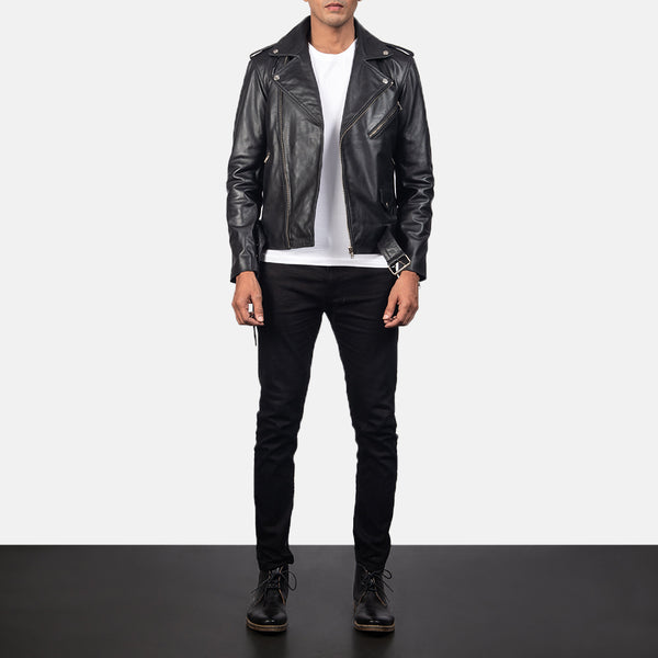 A person wearing a Allaric Leather Biker Jacket  with a standing collar, zipper details, and front pockets, paired with a white t-shirt and black pants.