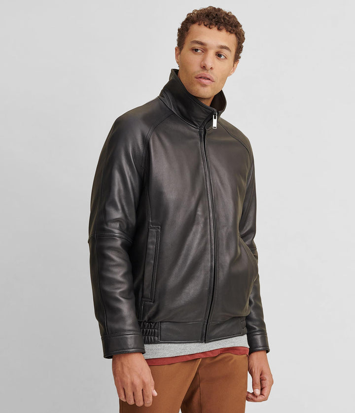 Tilted front side  view of Black Thinsulate Lined Leather Bomber jacket  with closed zipper